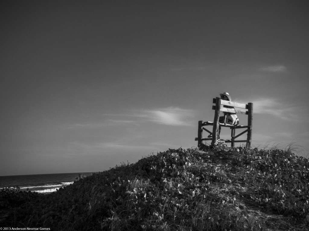She, a bench and the sea.